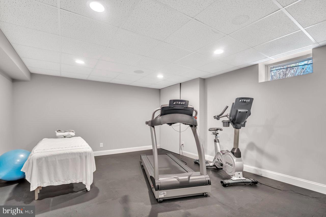 17 Banyan Road Skillman, NJ 08558 - Photo 44 of 53 a room with gym equipment and view of living room