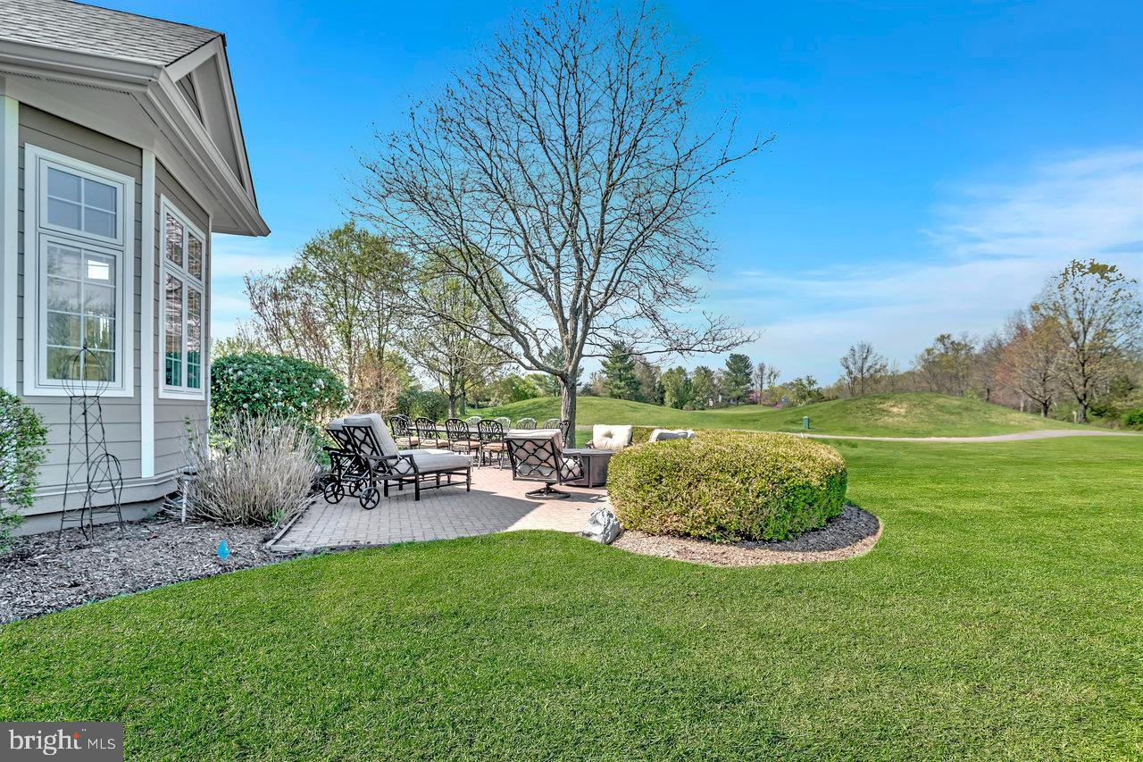 17 Banyan Road Skillman, NJ 08558 - Photo 47 of 53 a view of a chair and table in backyard of the house