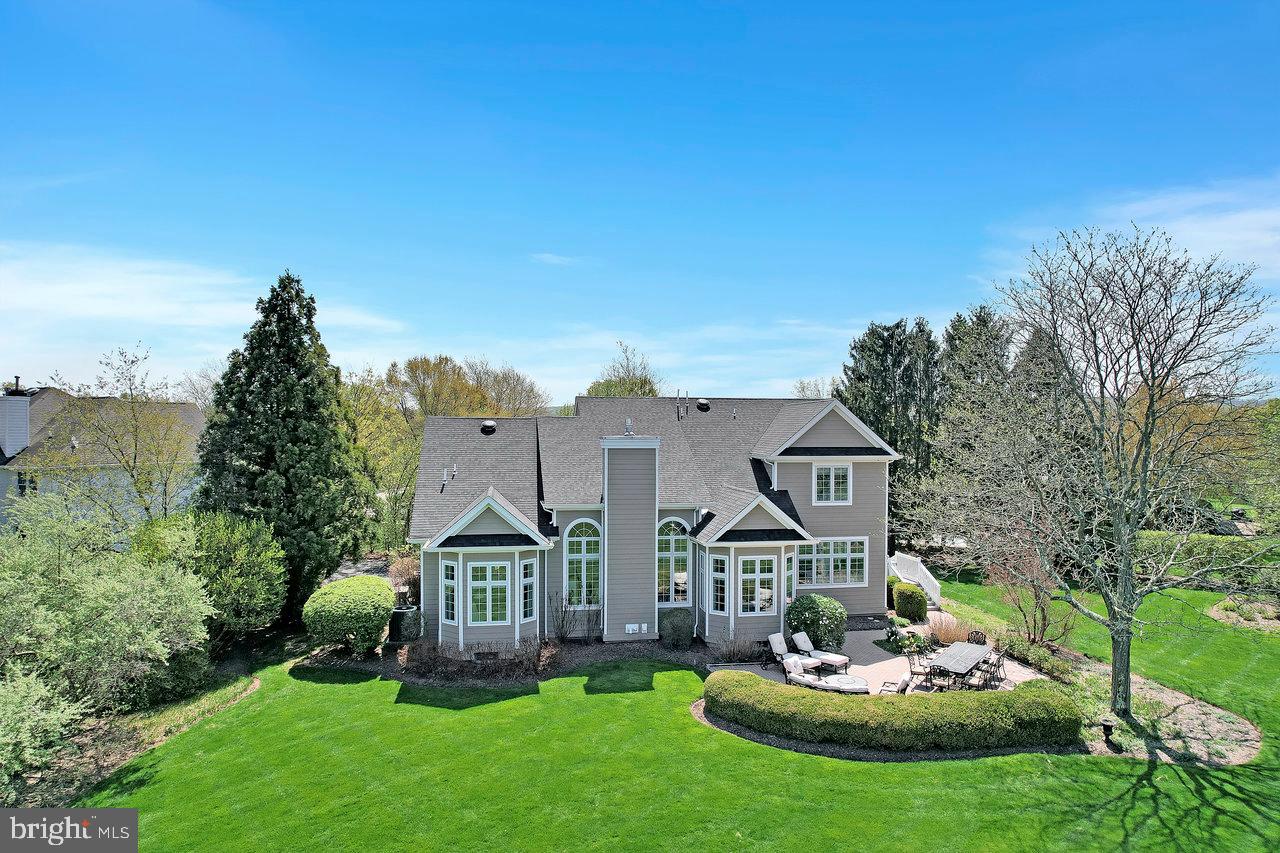 17 Banyan Road Skillman, NJ 08558 - Photo 49 of 53 a front view of a house with a garden and trees