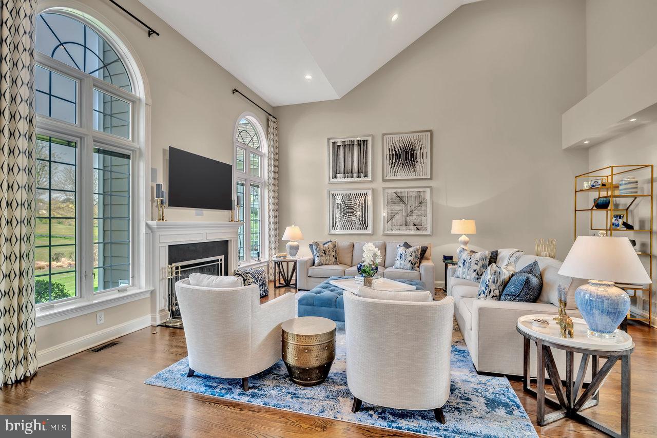 17 Banyan Road Skillman, NJ 08558 - Photo 10 of 53 a living room with furniture a flat screen tv and a fireplace