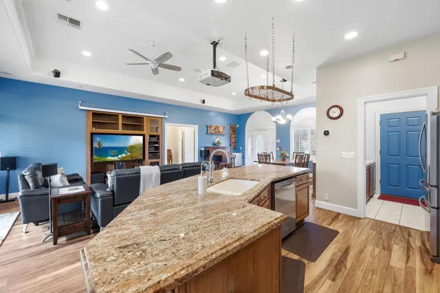 a view of a living room and kitchen