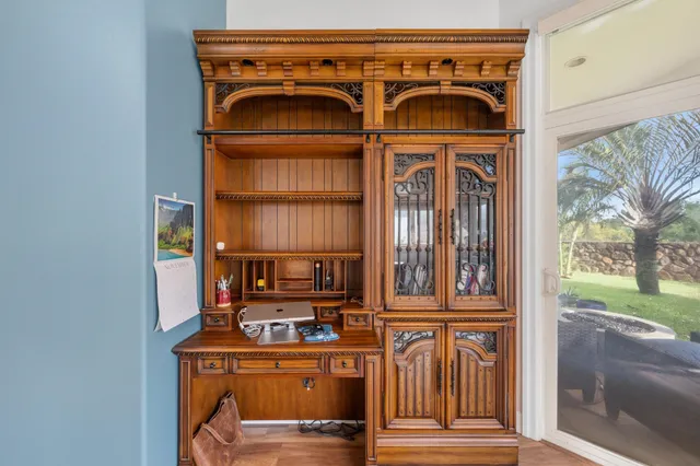 a view of front door with wooden door