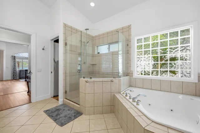a bathroom with a bathtub sink and shower