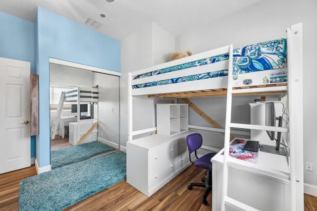 a utility room with cabinets and washer dryer