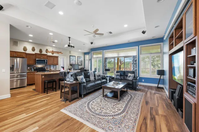 a living room with lots of furniture and a flat screen tv