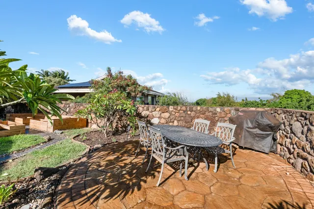 a view of a chairs and table in the patio