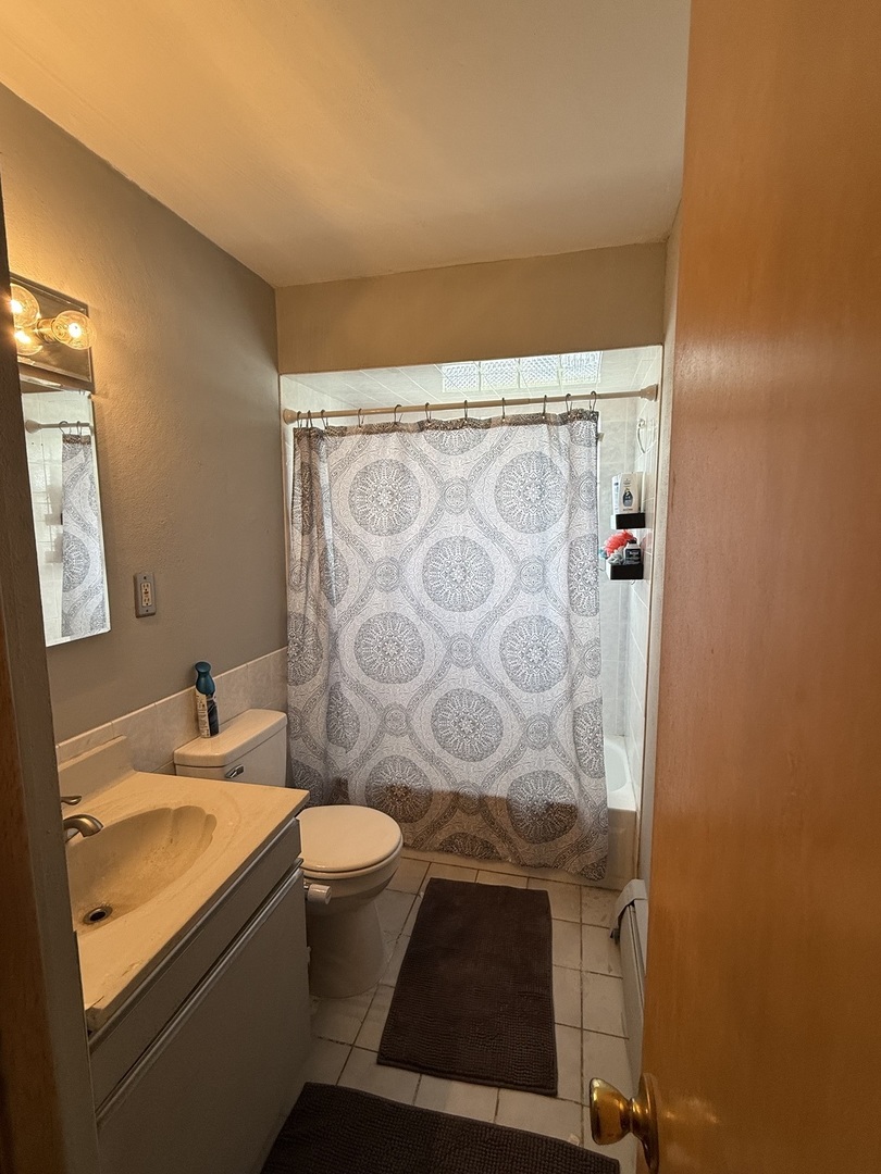 5653 Dover Road Oak Forest, IL 60452 - Photo 12 of 17 a bathroom with a granite countertop sink and a toilet