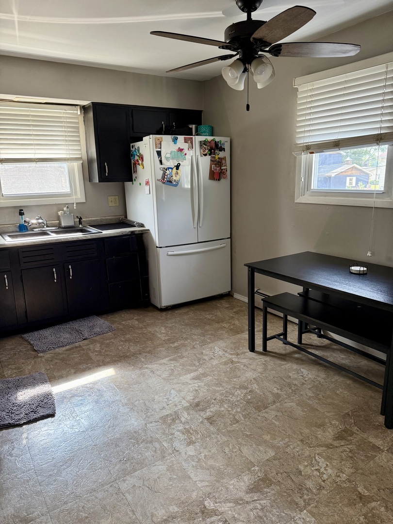 5653 Dover Road Oak Forest, IL 60452 - Photo 5 of 17 a kitchen with refrigerator and window