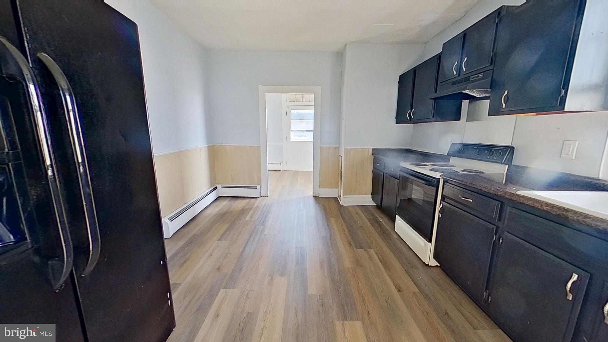 127 Nashville Boulevard Spring Grove, PA 17362 - Photo 4 of 16 a kitchen with stainless steel appliances a refrigerator and wooden floor