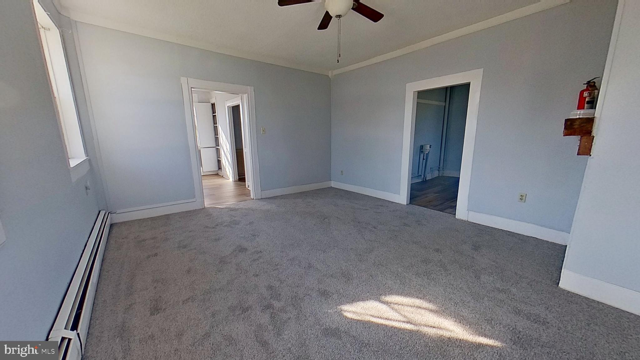 127 Nashville Boulevard Spring Grove, PA 17362 - Photo 8 of 16 an empty room with ceiling fan and window