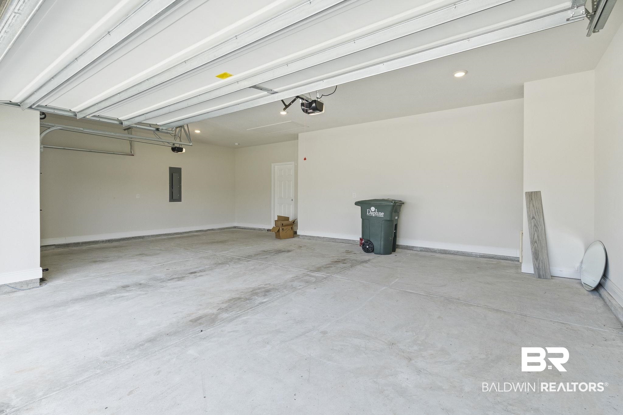 11303 Genuine Risk Circle Daphne, AL 36526 - Photo 66 of 100 Garage with a garage door opener and electric panel