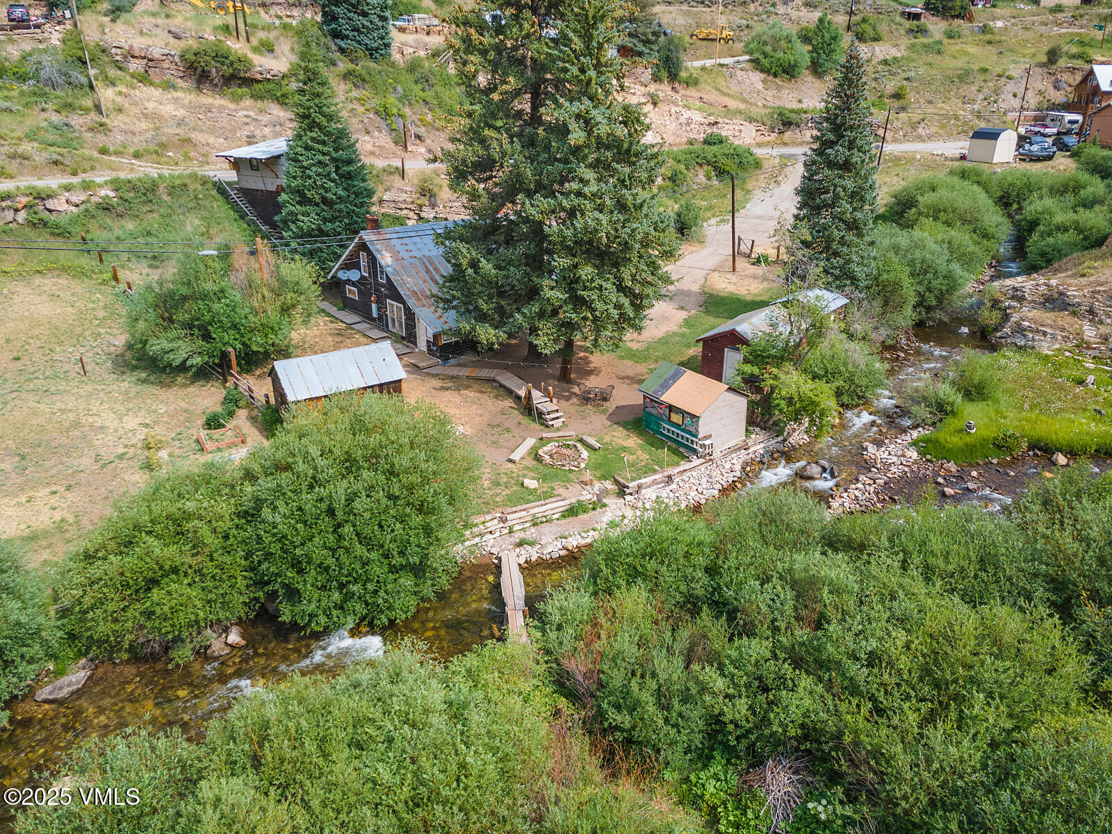 407 Water Street Red Cliff, CO 81649 - Photo 3 of 25 an aerial view of residential house with outdoor space and trees all around