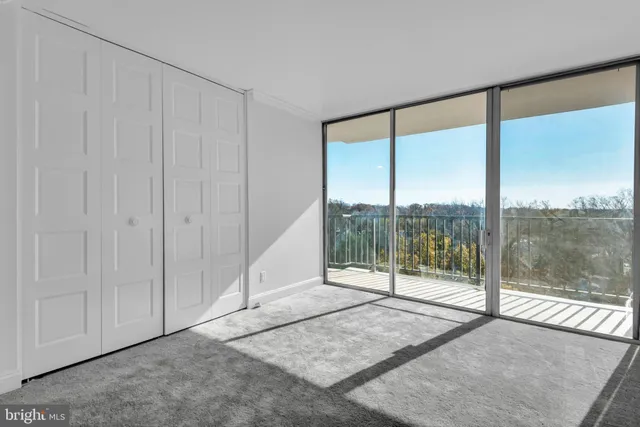 a view of a room with sliding glass door and glass door