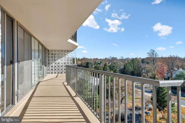 a view of a balcony with wooden floor