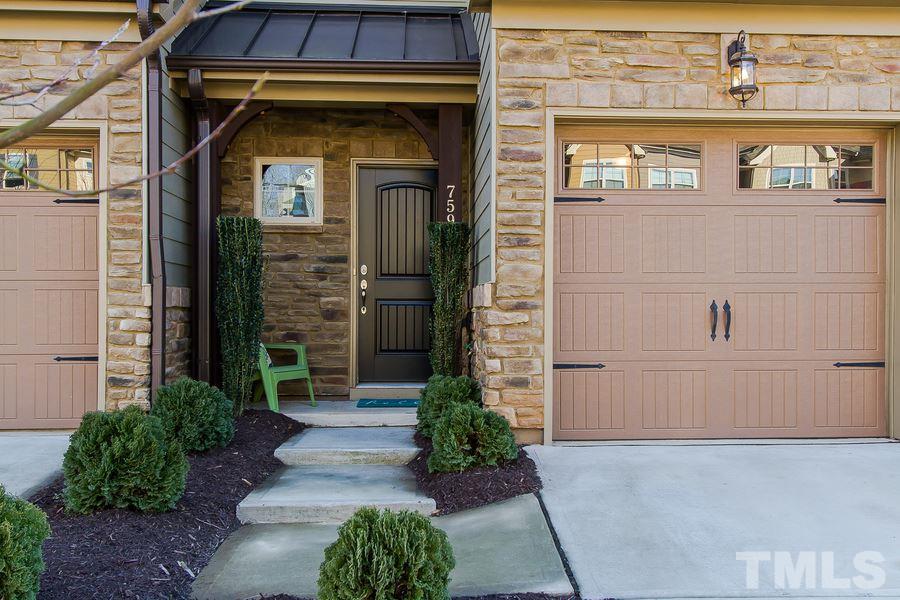 759 Wickham Ridge Road Apex, NC 27539 - Photo 2 of 20 Welcome home to this lovely, landscaped town home that certainly feels warm and inviting.