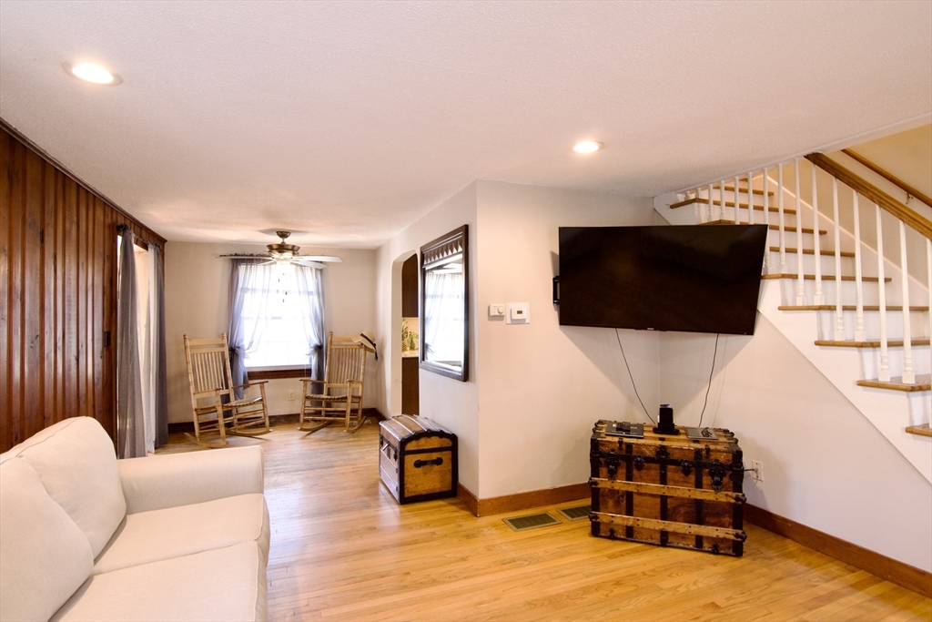 75 Wilton Street Springfield, MA 01109 - Photo 11 of 42 a living room with furniture and a flat screen tv