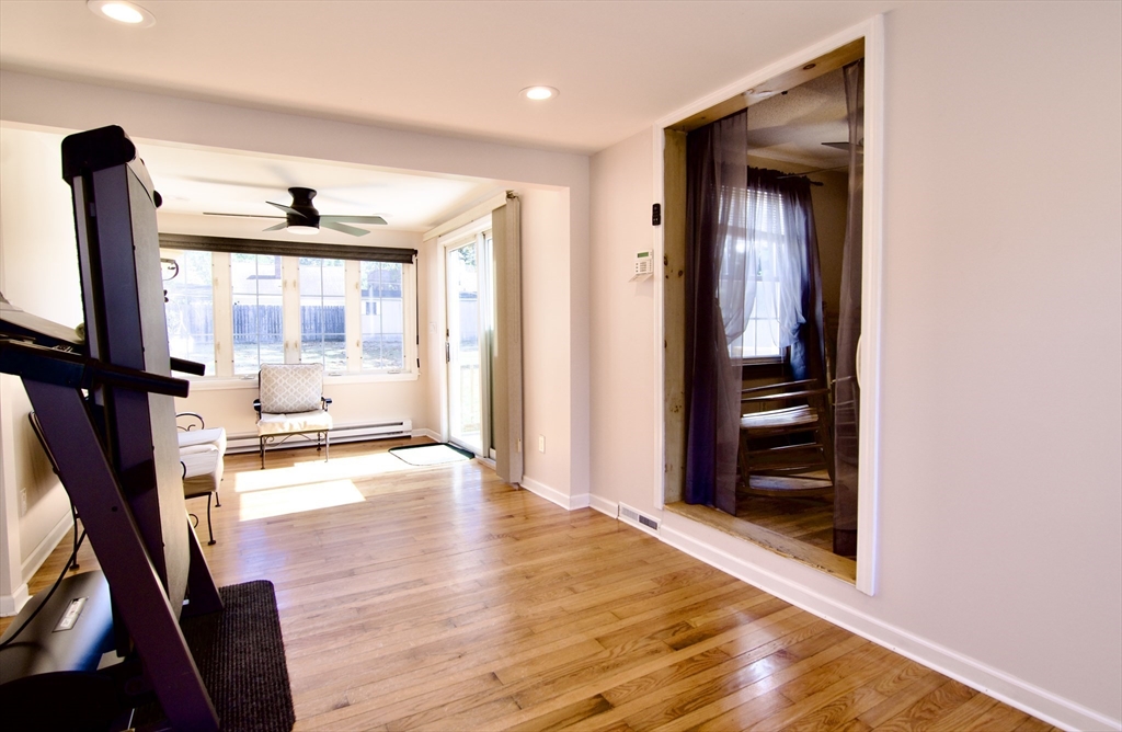 75 Wilton Street Springfield, MA 01109 - Photo 21 of 42 a view of a hallway with wooden floor and a bathroom