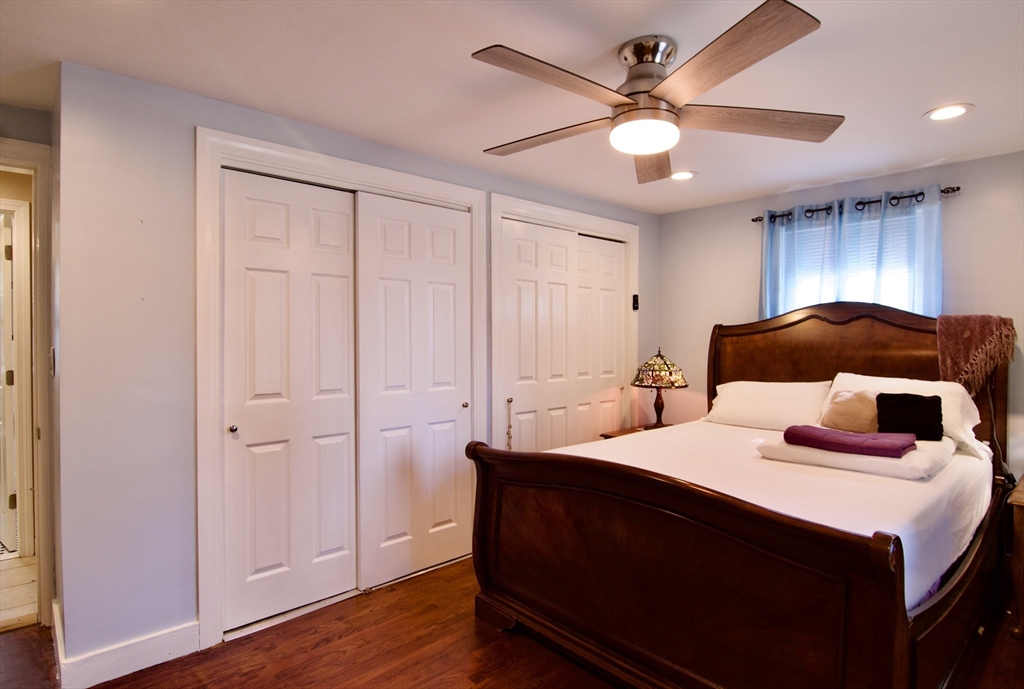 75 Wilton Street Springfield, MA 01109 - Photo 24 of 42 a bedroom with a bed and a ceiling fan