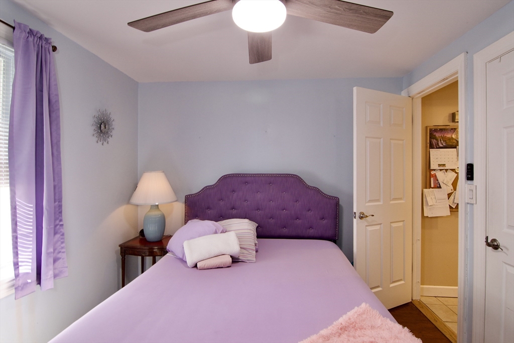 75 Wilton Street Springfield, MA 01109 - Photo 28 of 42 a bedroom with a bed and a lamp