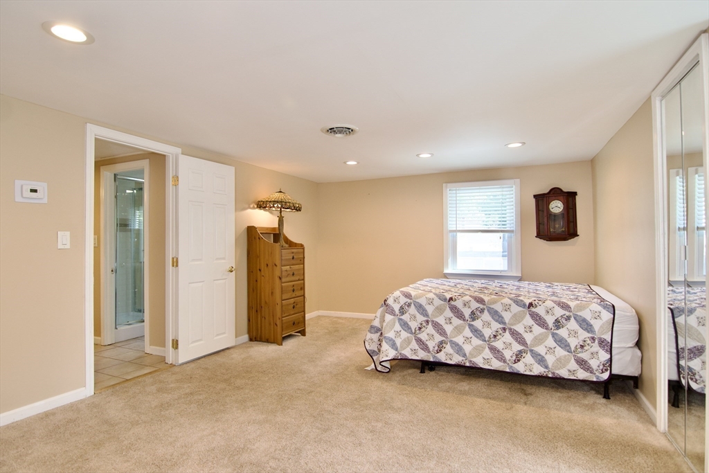 75 Wilton Street Springfield, MA 01109 - Photo 30 of 42 a spacious bedroom with a bed and a window