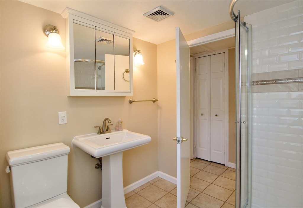 75 Wilton Street Springfield, MA 01109 - Photo 34 of 42 a bathroom with a sink and a mirror