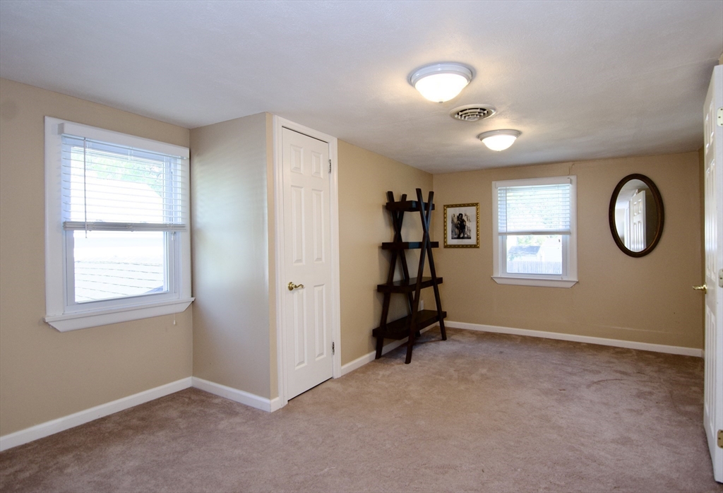 75 Wilton Street Springfield, MA 01109 - Photo 35 of 42 an empty room with windows and closet