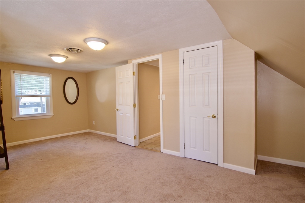 75 Wilton Street Springfield, MA 01109 - Photo 36 of 42 a view of an empty room with window and bathroom