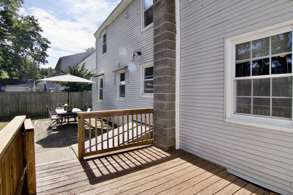 75 Wilton Street Springfield, MA 01109 - Photo 4 of 42 a view of a wooden deck with furniture