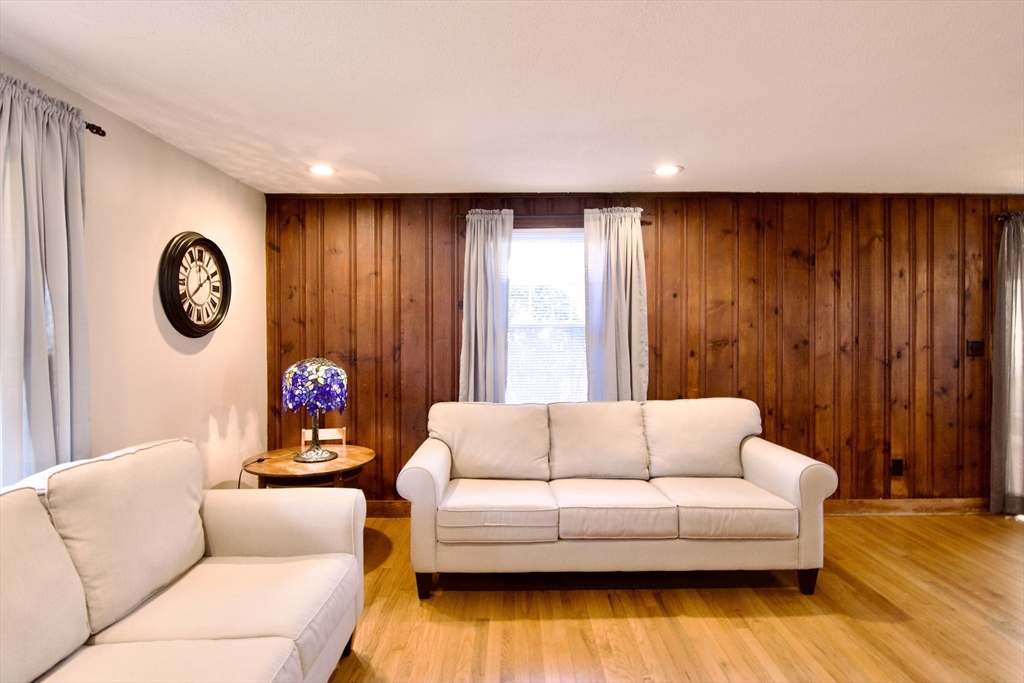 75 Wilton Street Springfield, MA 01109 - Photo 10 of 42 a living room with furniture and a large window