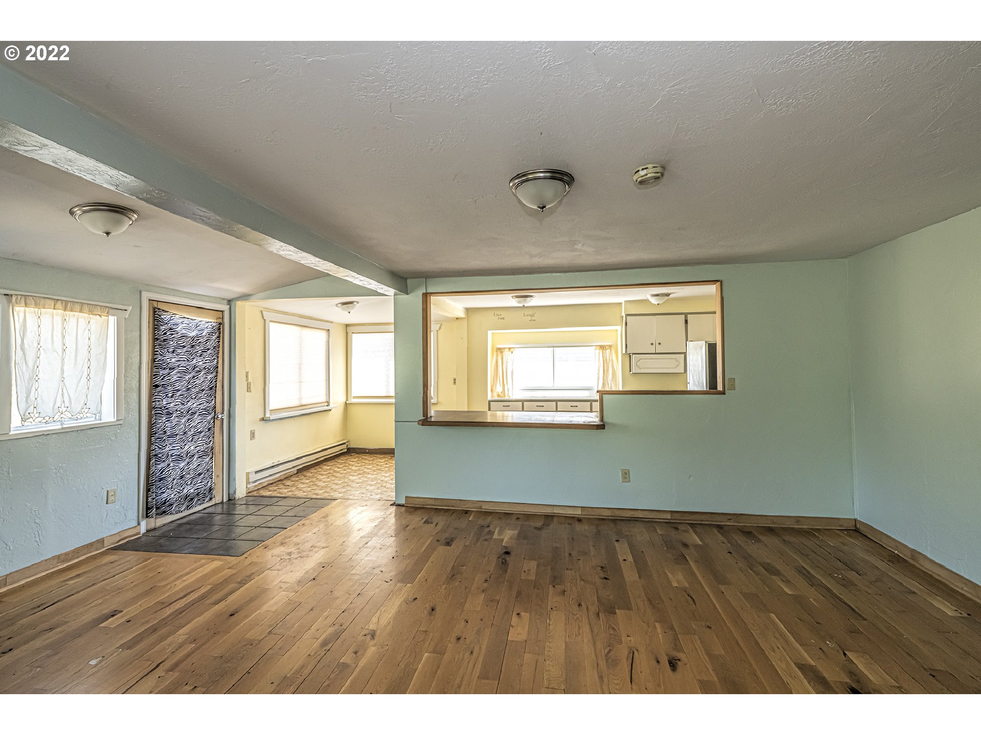 53486 Ruby Lane Milton Freewater, OR 97862 - Photo 16 of 27 a view of an empty room with wooden floor and a window