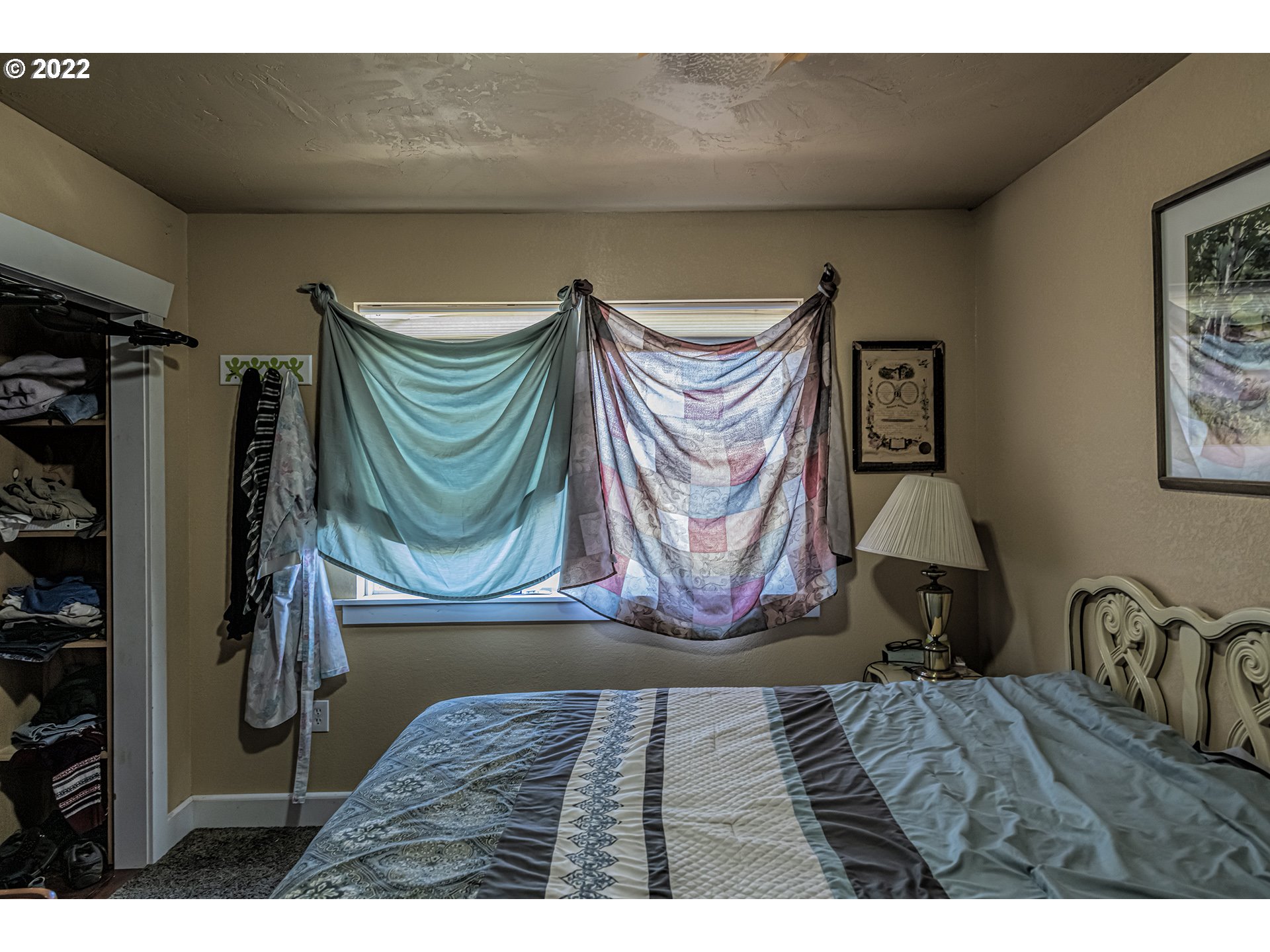 53486 Ruby Lane Milton Freewater, OR 97862 - Photo 22 of 27 a bedroom with a bed and a painting on the wall