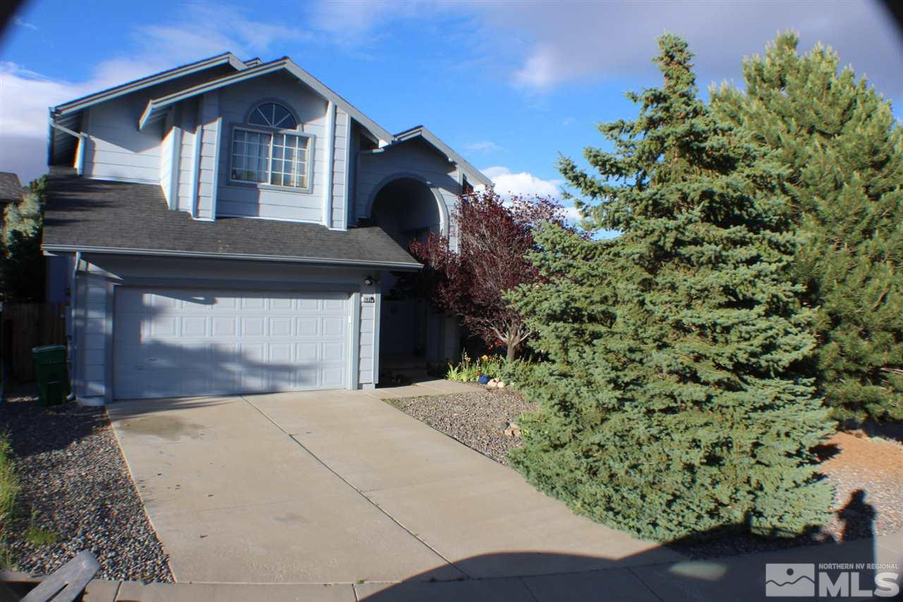 3939 Aspendale Drive Reno, NV 89503 - Photo 1 of 1 a front view of a house with a yard and garage