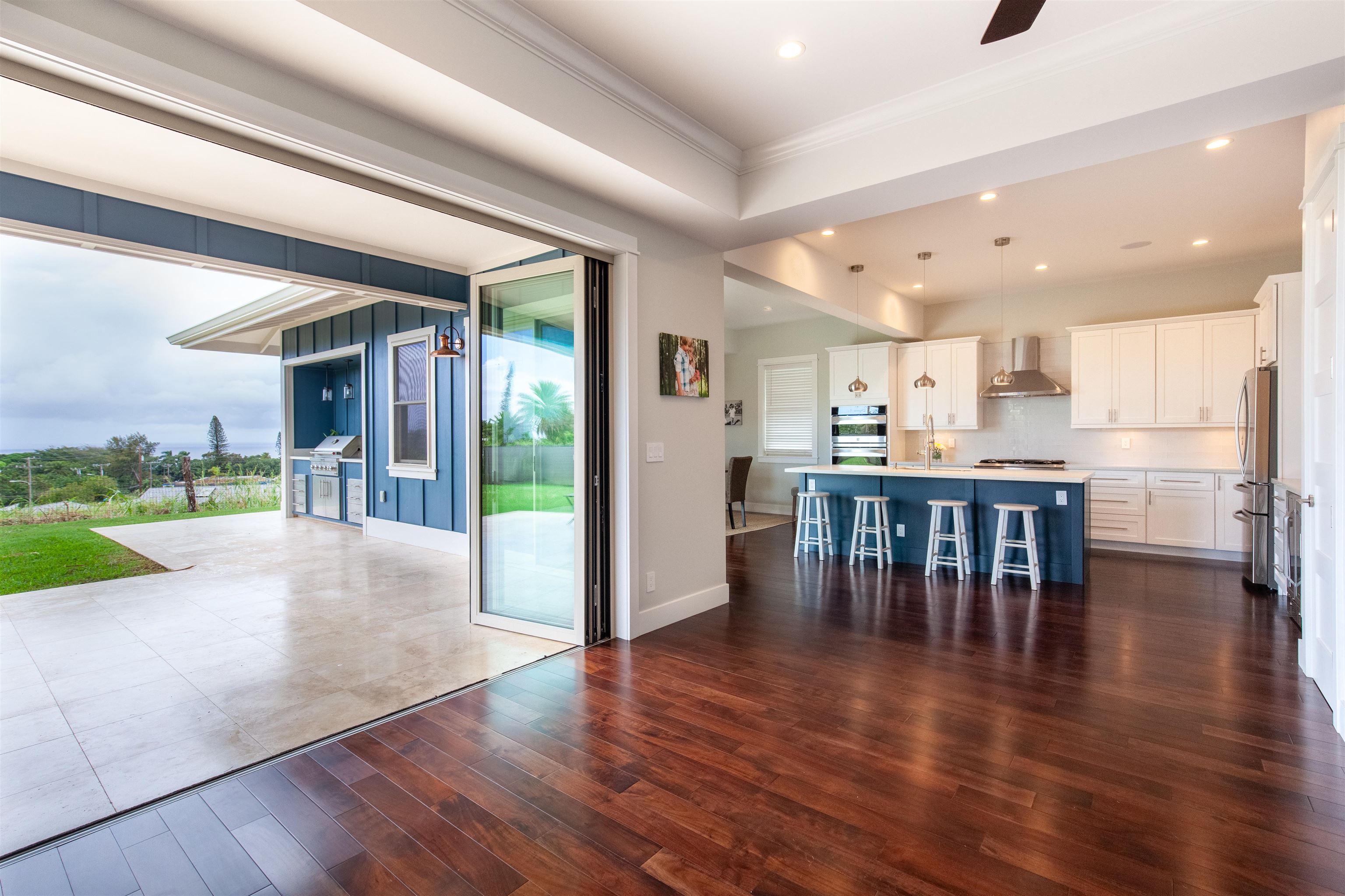 147-145 Pauwela Road Haiku, HI 96708 - Photo 5 of 30 a view of kitchen with stainless steel appliances refrigerator dining table and chairs
