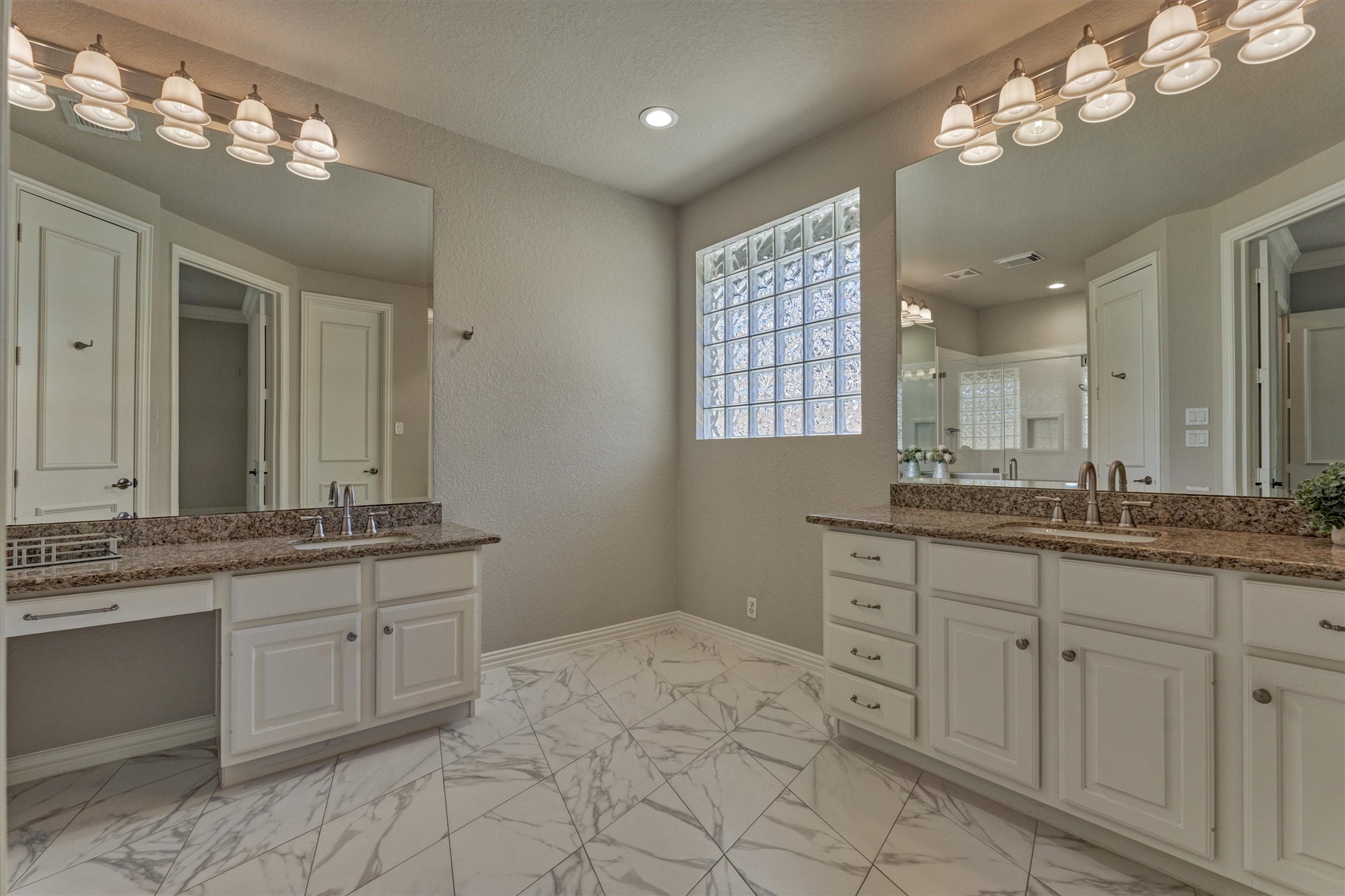 91 West Racing Cloud Court The Woodlands, TX 77381 - Photo 24 of 47 Spa-like primary bathroom boasts dual sinks and dedicated vanity space.