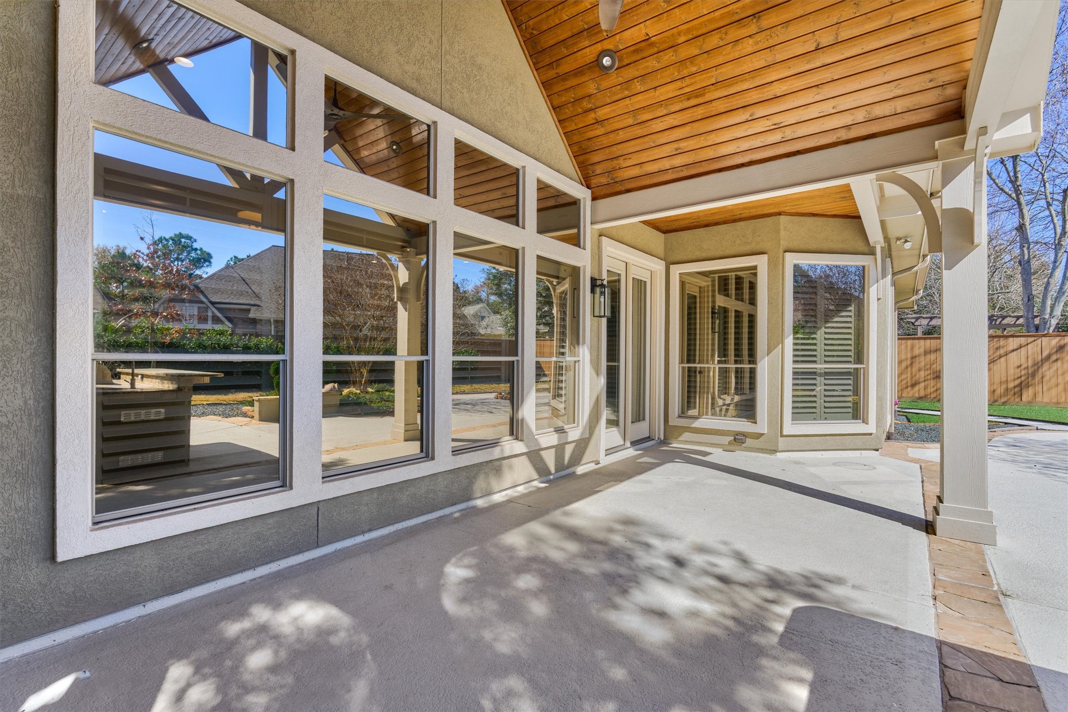 91 West Racing Cloud Court The Woodlands, TX 77381 - Photo 35 of 47 Covered patio with a beautiful cathedral ceiling is the perfect outdoor setting in the shade!