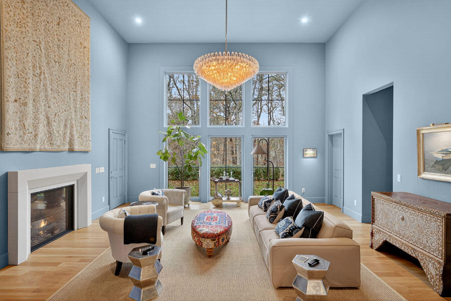 280 Ice Valley Road Osterville, MA 02655 - Photo 13 of 45 a living room with furniture a fireplace and a chandelier