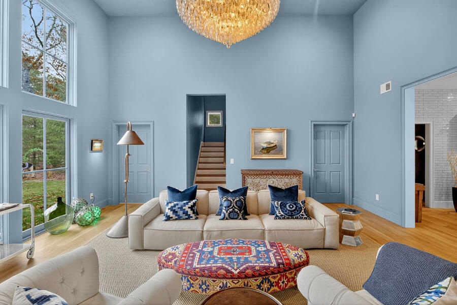 280 Ice Valley Road Osterville, MA 02655 - Photo 16 of 45 a living room with furniture a lamp and a fireplace