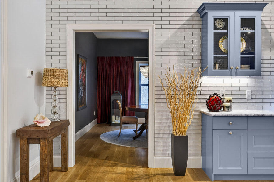 280 Ice Valley Road Osterville, MA 02655 - Photo 25 of 45 a hallway with a sink and a mirror