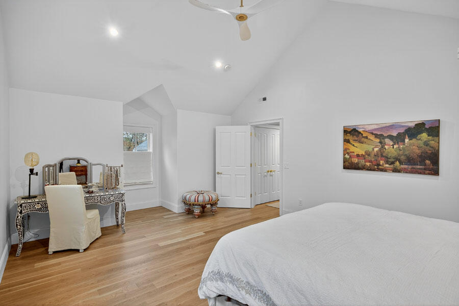280 Ice Valley Road Osterville, MA 02655 - Photo 37 of 45 a bedroom with a bed and wooden floor