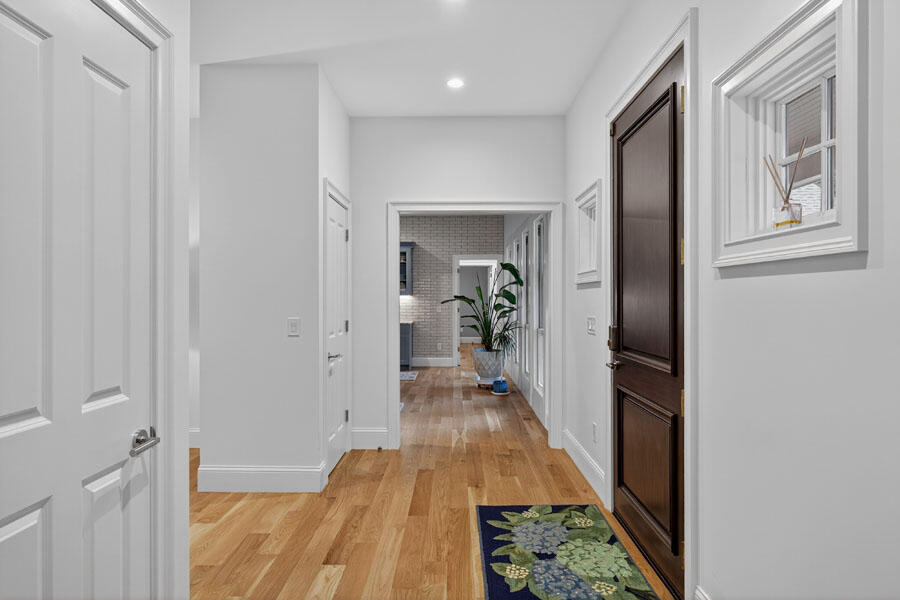 280 Ice Valley Road Osterville, MA 02655 - Photo 8 of 45 a view of a hallway with wooden floor and furniture