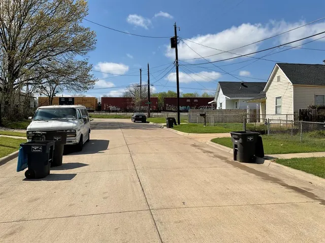 a view of a patio with a table chairs and a fire pit
