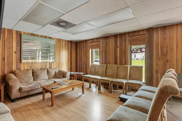 a living room with furniture and large window
