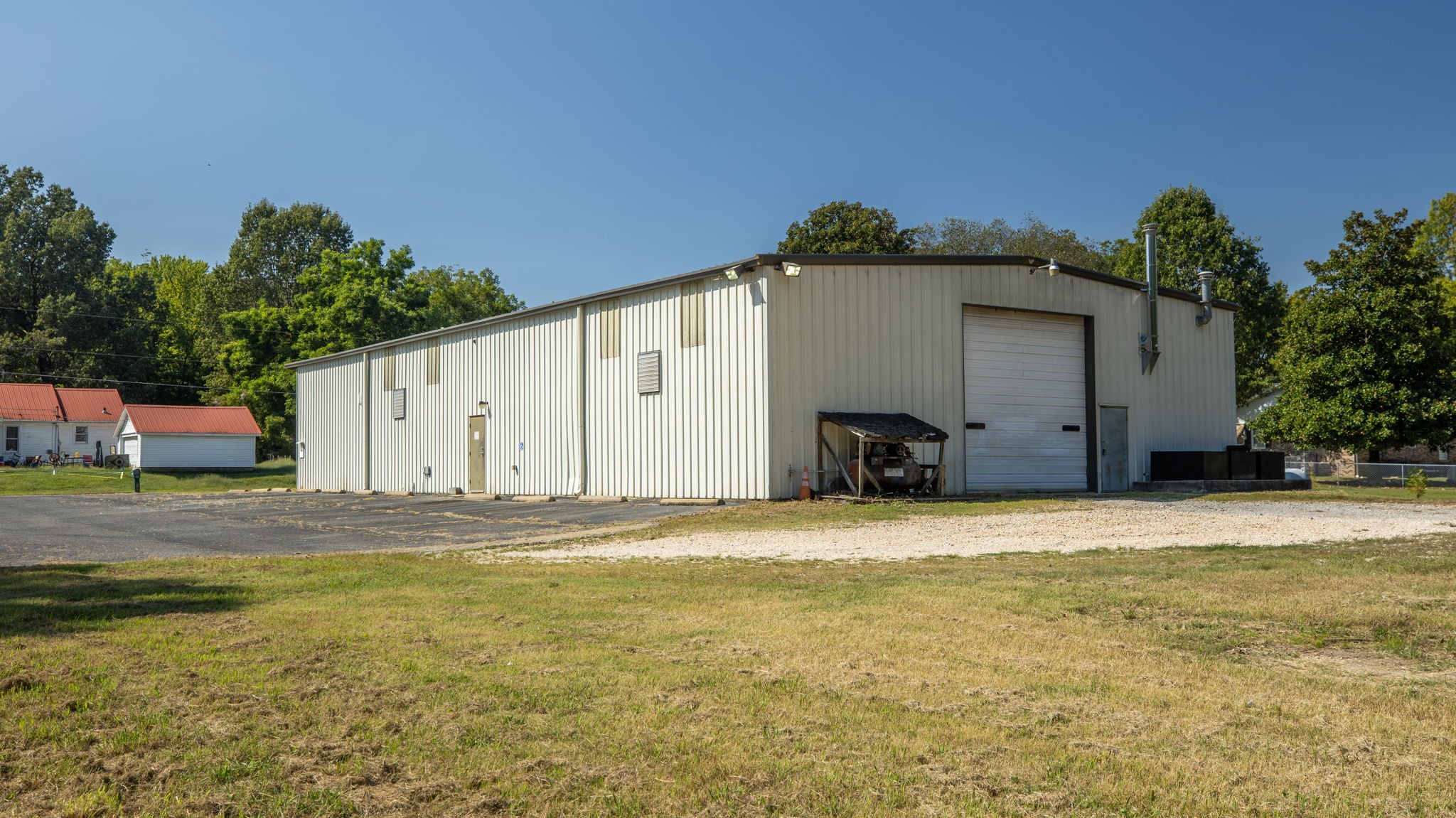 200 Tom Smith Road Martin, TN 38237 - Photo 3 of 51 a big house with a big yard and large trees