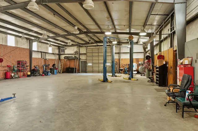 a view of empty room with wooden ceiling