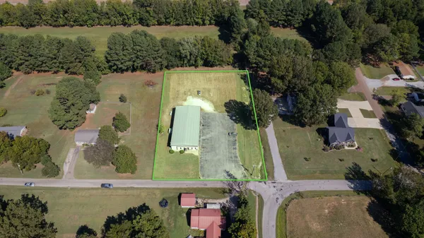 an aerial view of a house with a lake view
