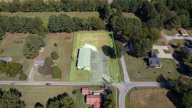an aerial view of a house with a lake view