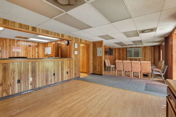 a view of a room with wooden walls