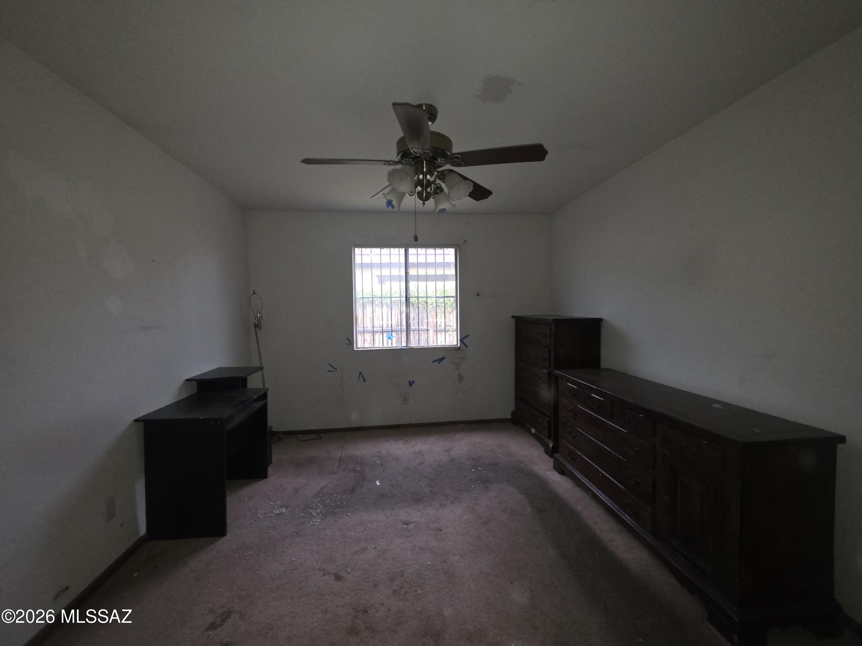 211 West Roger Road, Unit 24 Tucson, AZ 85705 - Photo 10 of 24 a living room with furniture and a window