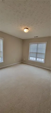 an empty room with a empty space and window