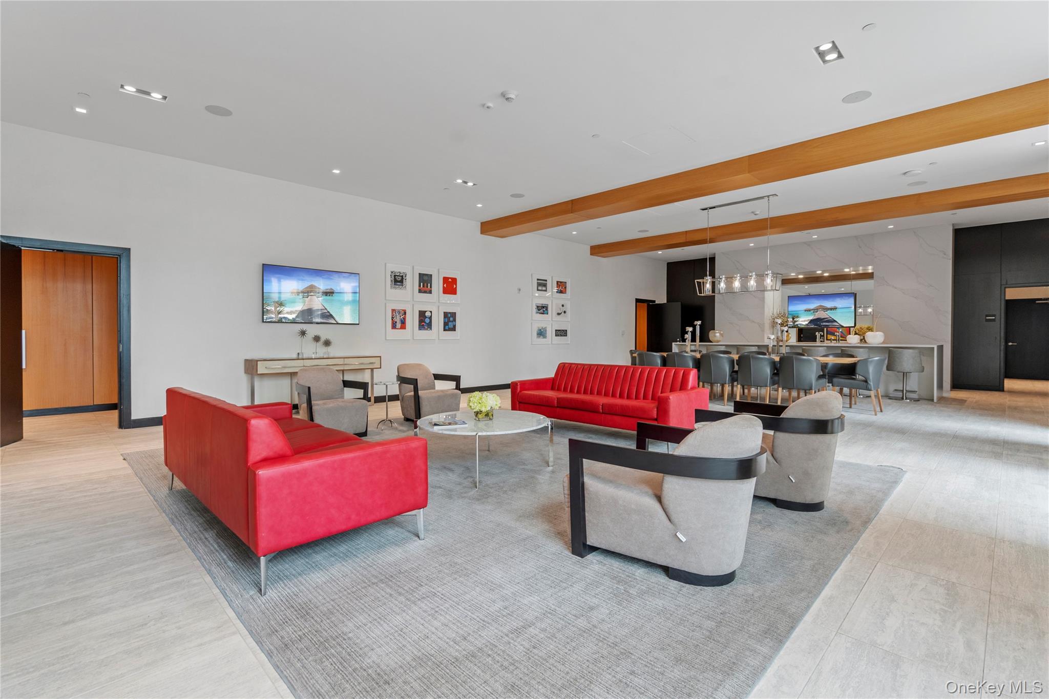 100 Garvies Point Road, Unit 1309 Glen Cove, NY 11542 - Photo 27 of 36 a living room with furniture and kitchen view